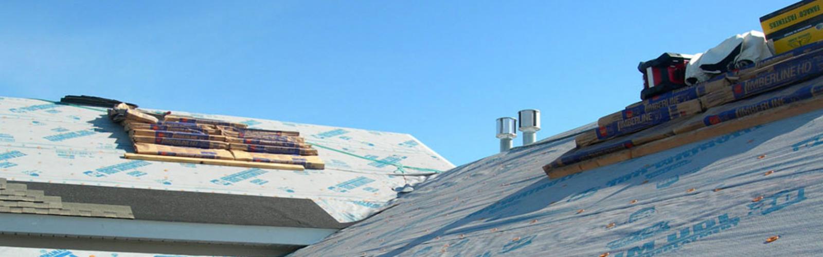 installing shingles bozeman mt roof hail damage Harmon Enterprises Construction
